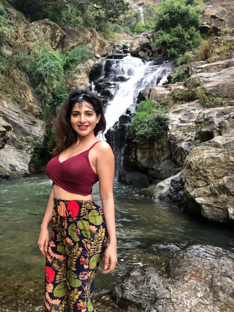 Captivating curvy beauty Actress IswaryaMenon sizzles in this latest photoshoot shot at a waterfall