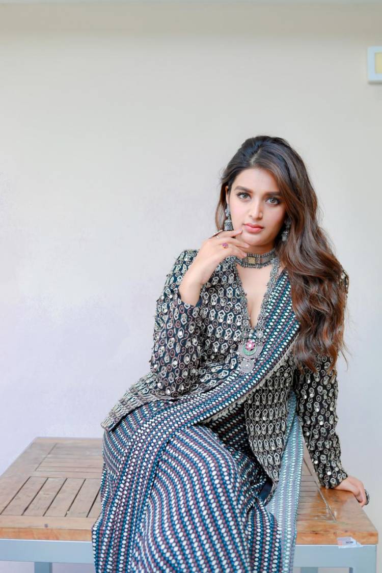 The bright & beautiful #NidhhiAgerwal is busy promoting her pongal releases #Bhoomi & #Eeswaran
